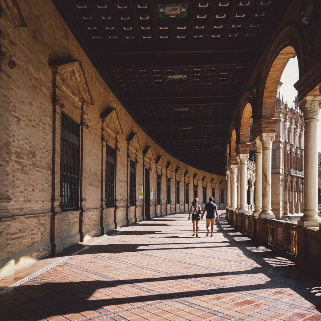 man and woman walking on hallway