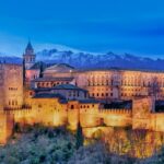 beautiful building near snowy mountains